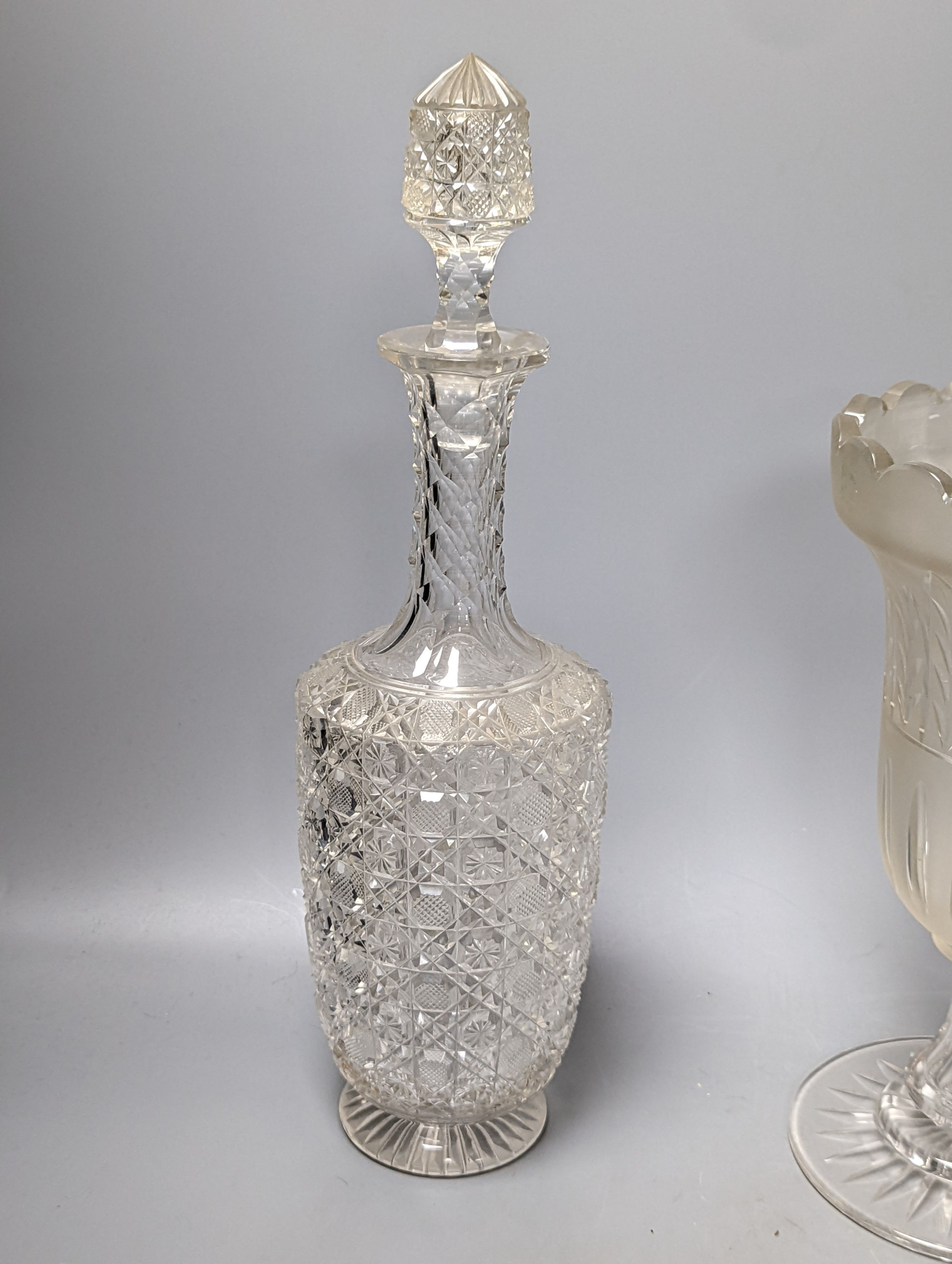 A Victorian wheel engraved ewer,with quinine scenes after the antique, 26 cms high, including 3 celery vases and a decanter.